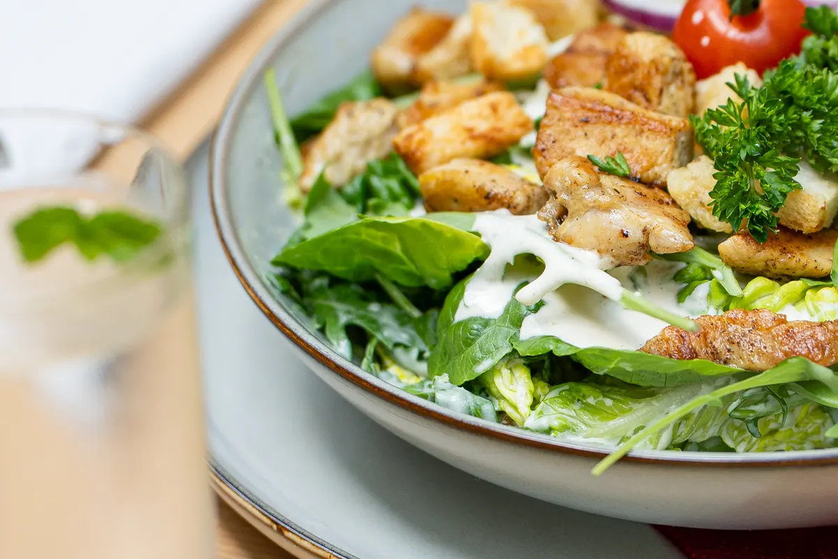 Classic Caesar salad with chicken strips at Restaurant Schachenwald